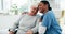 Medical, black woman nurse hugging a senior patient in a wheelchair and support in a hospital. Healthcare, trust and a