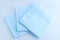 Medical blue absorbent diaper wipes on white background