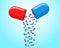 Medical capsule pill open with falling out colorful molecules. Medicine drug vitamin improve health concept. Red and