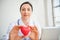 Medical Cardiologist Doctor is Holding Red Heart Give to Patient, Female Physician Doctor Showing Heart Model to Her Patients in