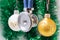 Medical Christmas and New Year. Stethoscope surrounded by white and gold christmas tree balls with blurred christmas decoration on