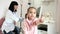 Medical clinic, child smiling shows sign of approval, Portrait of happy kid at doctor`s reception, sitting on couch