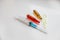 Medical colorful vials for injection syringe and red heart on a white background. Healthy heart. lifestyle. Copy space