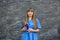 Medical concept. Beautiful young nurse in blue uniform holds pills