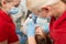 Medical dentist team in dental office with female patient preparing for treatment. dentist and assistent in process