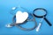 Medical device for listening stethoscope, heart, magnifier, syringe for injection, on a blue background, concept of medical