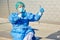 Medical doctor or containment scout in protective clothing shows thumbs up