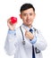Medical doctor holding heart squeezing ball