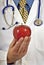 Medical Doctor Holding Red Apple Vertical Shot