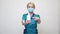 Medical doctor nurse wearing protective mask - holding sanitizing spray or gel or liquid soap