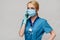 Medical doctor nurse woman with stethoscope wearing protective mask and rubber or latex gloves talking on mobile cell