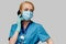 Medical doctor nurse woman with stethoscope wearing protective mask and rubber or latex gloves talking on mobile cell