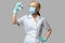 Medical doctor nurse woman wearing protective mask and gloves - holding virus blood test