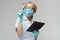 Medical doctor nurse woman wearing protective mask and gloves - holding virus blood test and tablet pc