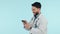 Medical doctor, phone or happy man in studio for communication, social media or email. Arab healthcare worker and