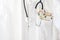 Medical doctor or physician coat with stethoscope and euro money in the pocket, healthcare costs and corruption concept with copy