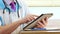 Medical doctor using modern touchscreen digital tablet