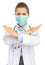 Medical doctor woman in mask showing stop gesture