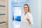 Medical doctor woman smile, nurse wear white surgery suit, point finger up, concept of advertisement product, empty copy