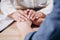 Medical Employee Covering Patient`s Hands With Her Own Hands