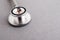 Medical equipment including stethoscope medicines background, top view flat lay