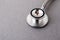 Medical equipment including stethoscope medicines background, top view flat lay