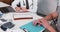 Medical exam concept. Close-up physician in lab coat, stethoscope consulting patient at clinic office table with papers.