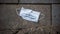 Medical face mask on the floor in street. Lost disposable mask for coronavirus
