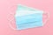 Medical face mask, Medical protective mask on pink background. Disposable surgical face mask cover the mouth and nose