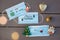 Medical flat lay - 3 medical protective masks with different written Christmas wish, painted smile, decorations