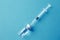 Medical glass vials and syringe for vaccination. liquid drug or vaccine for treatment, flu in laboratory, hospital or