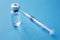 Medical glass vials and syringe for vaccination. liquid drug or vaccine for treatment, flu in laboratory, hospital or