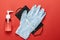 Medical gloves surgical mask, sanitizer gel thermometer - Virus protection equipment on red background. Pathogen