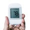 Medical instrument, digital handheld blood sugar detector use to measure patient blood sugar isolated on white background.