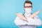 Medical male doctor wear a mask to prevent coronavirus 2019 and standing and raising hand to show the symbol of wrong