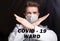 Medical male doctor wear a mask to prevent coronavirus 2019 and standing and raising hand to show the symbol of wrong