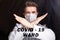 Medical male doctor wear a mask to prevent coronavirus 2019 and standing and raising hand to show the symbol of wrong