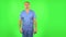 Medical man is angry, says something and sighs. Green screen