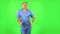 Medical man is dancing funny, rejoices. Green screen