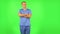 Medical man daydreaming and smiling looking up. Green screen