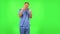 Medical man emotionally watches something, comments and then rejoices in victory. Green screen