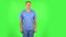 Medical man flirts and winks while looking at the camera. Green screen