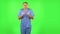Medical man looking at camera with anticipation, then very upset. Green screen