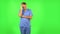 Medical man thinks about something. Green screen