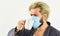 Medical mask as corona protection. man drink coffee in respirator protective mask. coronavirus pandemic outbreak. Doctor