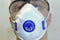 Medical mask, filter respirator on a man face