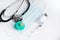 Medical mask, stethoscope, syringe with medicine and pacifier on a light background. Vaccinations for children