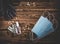 Medical masks, pills, antiseptic in a transparent plastic bottle and black rubber gloves on a wooden background. Covid-19 virus