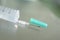 Medical needle on plastic syringe.