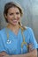 Medical professionals: Woman nurse smiling while working at hospital. Young beautiful blond caucasian female health care worker